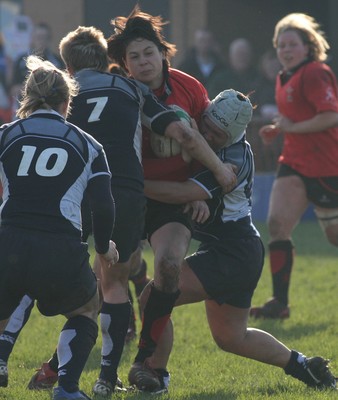 02.02.08 The Women's 6 Nations. Wales vs. Scotland. Taffs Well RFC, Cardiff, Wales. 
 
Naomi Thomas is tackled by Lynn Reid(7) & Mary Lafaiki. 
 
