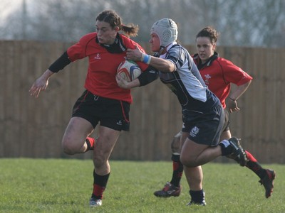 02.02.08 The Women's 6 Nations. Wales vs. Scotland. Taffs Well RFC, Cardiff, Wales. 
 
Louise Rickard powers through the tackle of Mary Lafaiki. 
 
