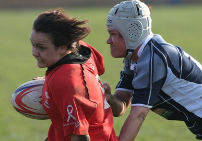 02.02.08 The Women's 6 Nations. Wales vs. Scotland. Taffs Well RFC, Cardiff, Wales. 
 
Amy Day's break is halted by Mary Lafaiki. 
 
