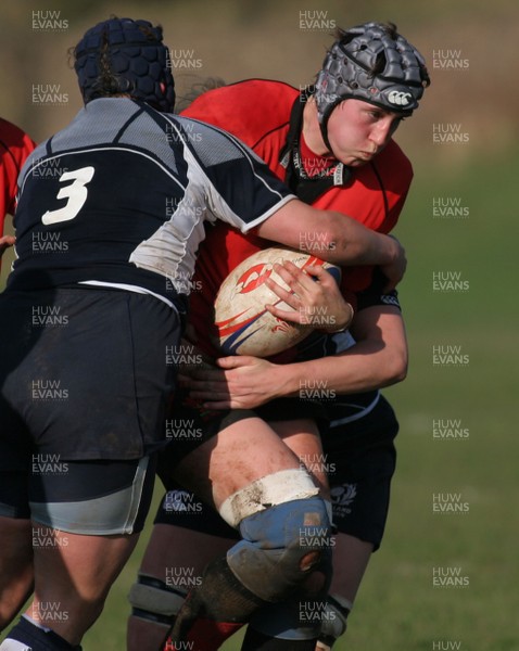 02.02.08 The Women's 6 Nations. Walesvs. Scotland. Taffs Well RFC, Cardiff, Wales. 
 
Louise Horgan's charge is halted by Beth Dickson(3) & Lyndsey Wheeler. 
 
