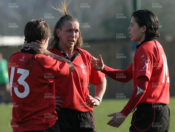 02.02.08 The Women's 6 Nations. Wales vs. Scotland. Taffs Well RFC, Cardiff, Wales. 
 
(L-R)) Rachel Poolman(13) Clare Flowers & Naomi Thomas discuss tactics during a break in play. 
 

