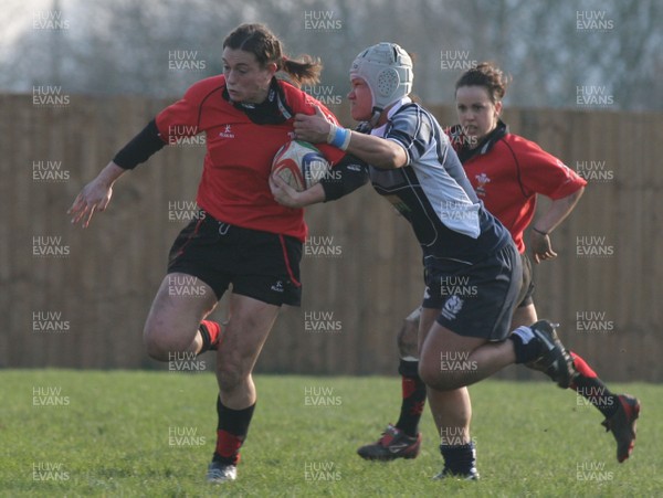 02.02.08 The Women's 6 Nations. Wales vs. Scotland. Taffs Well RFC, Cardiff, Wales. 
 
Louise Rickard powers through the tackle of Mary Lafaiki. 
 
