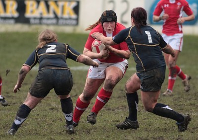 120212 Wales v Scotland - Womens 6 Nations rugby -  Wales' Caryl Thomas charges into Scotland's Sarah Quick(2) and Suzanne McKerlie-Hex