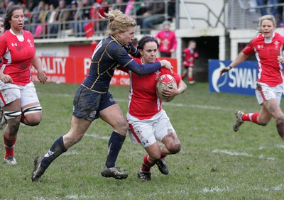 120212 Wales v Scotland - Womens 6 Nations rugby -  Wales' Amy Day holds off Scotland's Sarah Dixon to score her second try