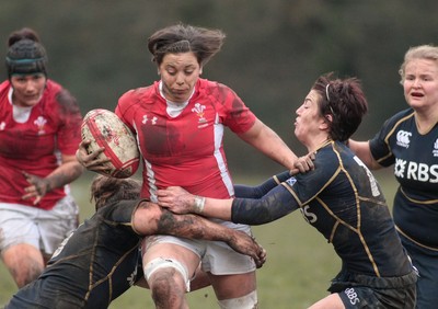 120212 Wales v Scotland - Womens 6 Nations rugby -  Wales' Sioned Harries takes on Scotland's Jemma Foryth(L) and Caroline Collie 