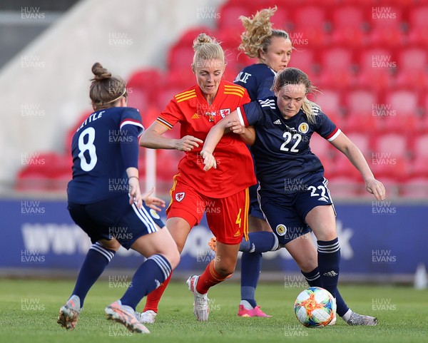 150621 - Wales Women v Scotland Women - International Friendly - Sophie Ingle of Wales is tackled by Erin Cuthbert of Scotland