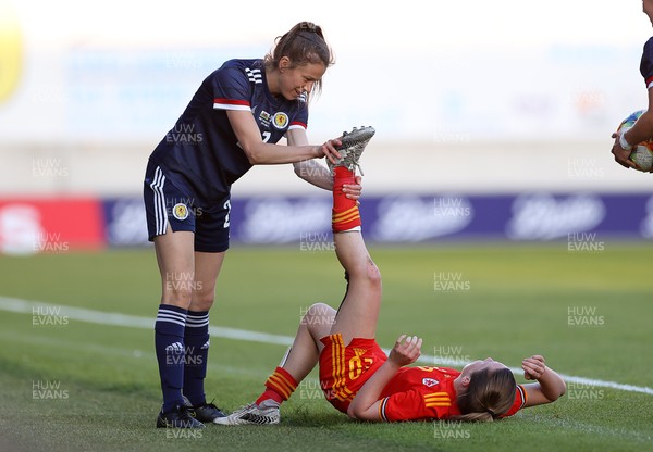 150621 - Wales Women v Scotland Women - International Friendly - Lizzie Arnot of Scotland helps out Carrie Jones of Wales on the pitch