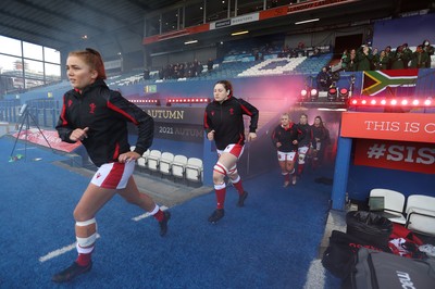 131121 - Wales Women v South Africa Women - Autumn Internationals - Niamh Terry and Gwen Crabb of Wales run out onto the field