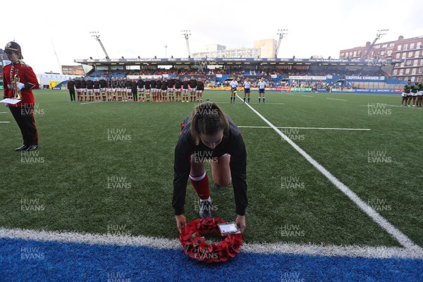 131121 - Wales Women v South Africa Women - Autumn Internationals - Siwan Lillicrap of Wales lays a remembrance wreath