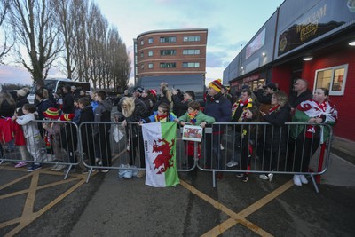 250225 - Wales v Sweden - UEFA Women's Nations League - Fans gather to greet the Wales team arriving 