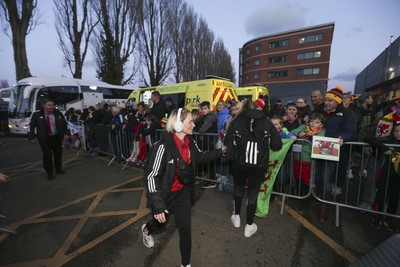 250225 - Wales v Sweden - UEFA Women's Nations League - Fans gather to greet the Wales team arriving 