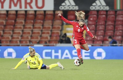 250225 - Wales v Sweden - UEFA Women's Nations League - Emma Kullberg of Sweden and Kayleigh Barton Wales