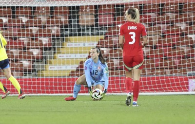 250225 - Wales v Sweden - UEFA Women's Nations League - Jennifer Falk of Wales gathers the ball