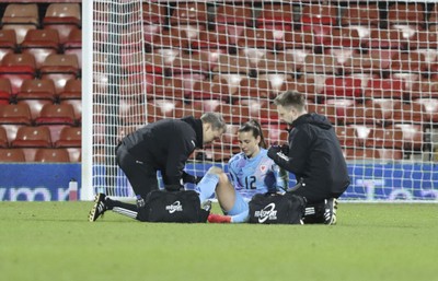 250225 - Wales v Sweden - UEFA Women's Nations League - Jennifer Falk of Wales receives treatment for an injury