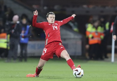 250225 - Wales v Sweden - UEFA Women's Nations League - Hayley Ladd of Wales stretches for the ball