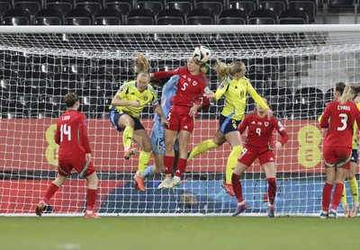 250225 - Wales v Sweden - UEFA Women's Nations League - Rhiannon Roberts of Wales heads clear