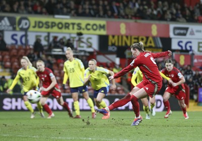 250225 - Wales v Sweden - UEFA Women's Nations League - Kayleigh Barton of Wales scores a penalty to equalise