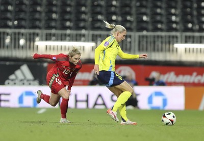 250225 - Wales v Sweden - UEFA Women's Nations League - Jessica Fishlock Wales chases down Jonna Andersson of Sweden