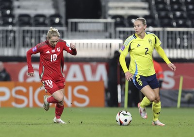 250225 - Wales v Sweden - UEFA Women's Nations League - Jessica Fishlock Wales chases down Jonna Andersson of Sweden