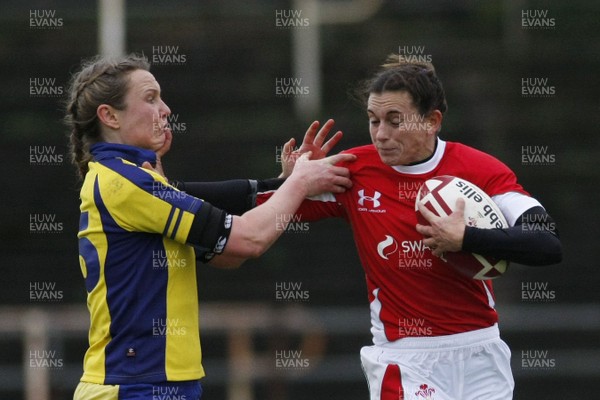 28.11.09 Wales v Sweden - Womens' Rugby International -  Wales' Louise Rickard powers through the Sweden defense. 