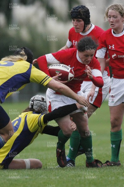 28.11.09 Wales v Sweden - Womens' Rugby International -  Wales captain Mel Berry powers through some tired Sweden defense.  