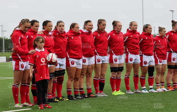 300923 - Wales Women v USA Women, International Test Match - The Wales team lineup for a minutes silence in memory of Glanmor Griffiths, and the national anthems