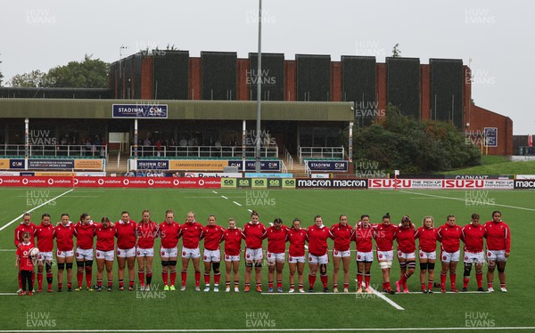 300923 - Wales Women v USA Women, International Test Match - The Wales team lineup for a minutes silence in memory of Glanmor Griffiths, and the national anthems