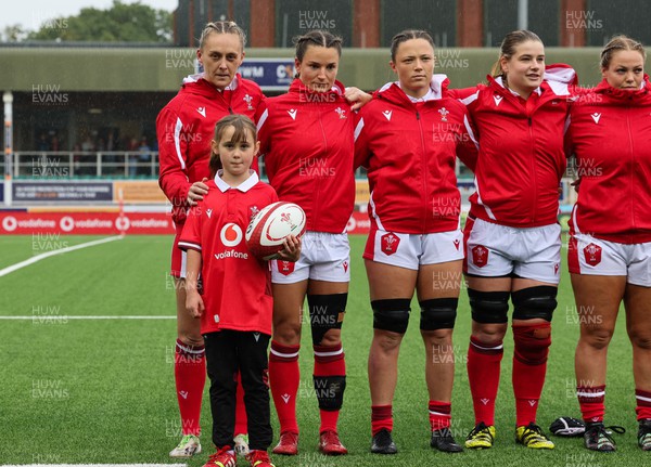 300923 - Wales Women v USA Women, International Test Match - The Wales team members Hannah Jones, Jasmine Joyce, Alisha Butchers, Bethan Lewis and Kelsey Jones  lineup for the national anthems