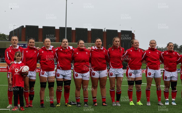300923 - Wales Women v USA Women, International Test Match - The Wales team lineup for a minutes silence in memory of Glanmor Griffiths, and the national anthems