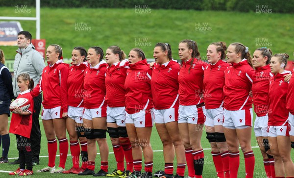 300923 - Wales Women v USA Women, International Test Match - The Wales team lineup for a minutes silence in memory of Glanmor Griffiths, and the national anthems