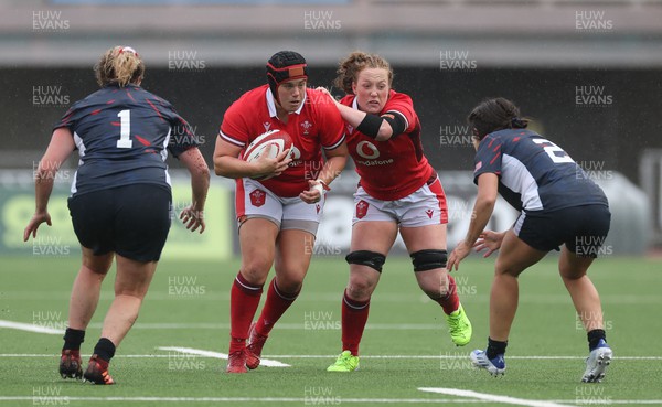 300923 - Wales Women v USA Women, International Test Match - Carys Phillips of Wales takes on Catie Benson of USA and Kathryn Treder of USA