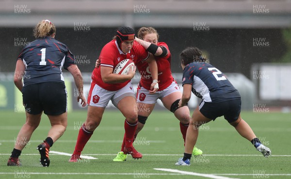 300923 - Wales Women v USA Women, International Test Match - Carys Phillips of Wales takes on Catie Benson of USA and Kathryn Treder of USA