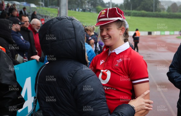 300923 - Wales Women v USA Women, International Test Match - Carys Cox of Wales with family and friends at the end of the match