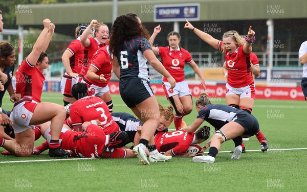 300923 - Wales Women v USA Women, International Test Match - Alex Callender of Wales celebrates as Keira Bevan of Wales powers over to score try