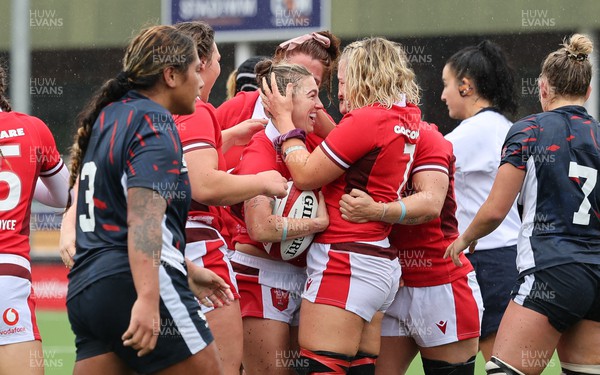300923 - Wales Women v USA Women, International Test Match - Alex Callender of Wales celebrates with Keira Bevan of Wales after Bevan powers over to score try