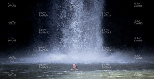 201022 - Wales Women Waterfall Recovery Session - Wales’ Robyn Wilkins enjoy a recovery session at waterfalls near Whangarei after training ahead of their Women’s Rugby World Cup match against Australia