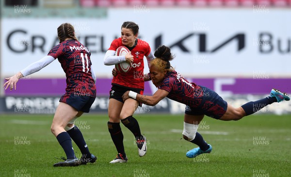 120322 - Wales Women XV v USA Falcons - Friendly Rugby International - Jasmine Joyce of Wales is tackled by Bulou Mataitoga of USA