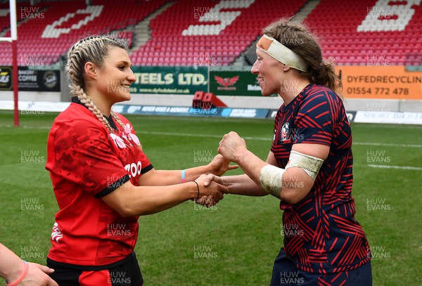 120322 - Wales Women XV v USA Falcons - Lowri Norkett of Wales and Kate Zachary of USA  at the end of the game