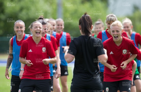 030619 - Wales Women's Football Squad Training Session - Wales' Loren Dykes, left, and Sophie Ingle share a joke during training session ahead of the Friendly International against New Zealand 