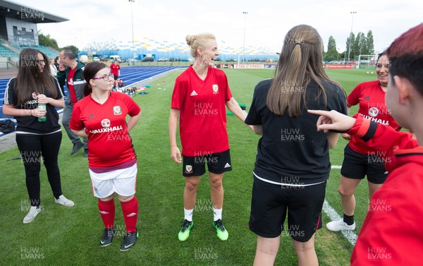 030619 - Wales Women's Football Squad Training Session - Wales' Womens football squad meet member of the Wales Homeless Football squad after their training session ahead of the Friendly International against New Zealand 
