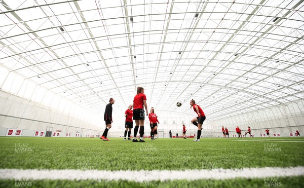 280519 - Wales Women's Football Squad Training Session, USW, Treforest - The Wales Women's Football squad and academy players warm up in the indoor training area at USW Treforest