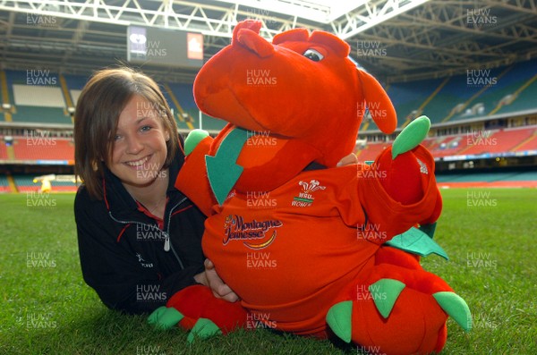 310107 - Wales Womens Rugby - Wales Woman's Rugby player, Rachel Poolman with the Wales Women's mascot, which she has to 'babysit' for being the latest member to join Welsh squad 