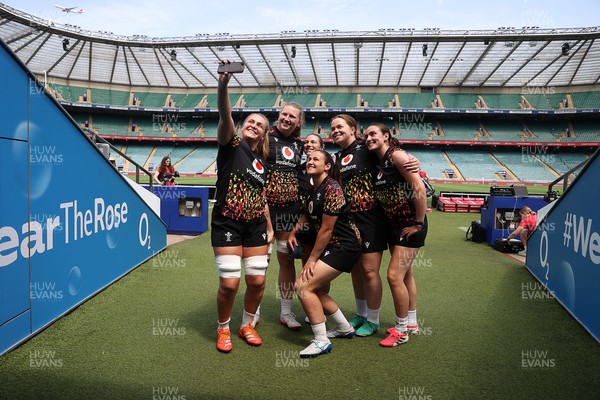 260626 - Wales Womens Rugby Captains Run at Twickenham ahead of their game against the Barbarians tomorrow - Alex Callender takes a selfie with team mates at the stadium