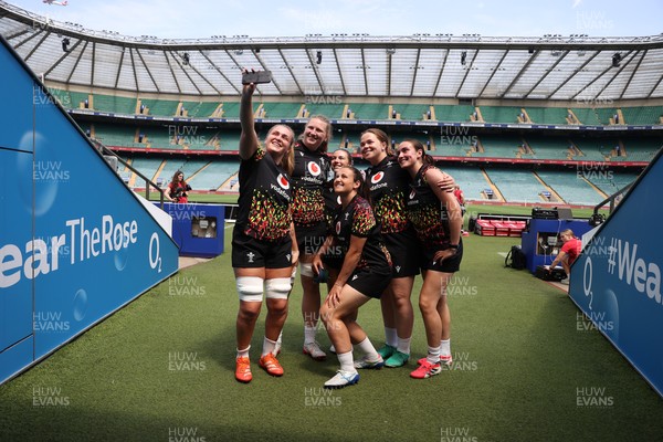 260626 - Wales Womens Rugby Captains Run at Twickenham ahead of their game against the Barbarians tomorrow - Alex Callender takes a selfie with team mates at the stadium