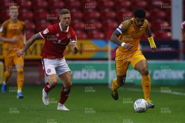 200819 - Walsall v Newport County - SkyBet League Two - Joss Labadie of Newport County is challenged by James Clarke of Walsall