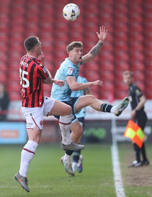 210326 - Walsall v Newport County - Sky Bet League 2 - Cameron Evans of Newport and Kacper Lopata of Walsall FC
