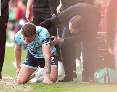 210326 - Walsall v Newport County - Sky Bet League 2 - Cameron Evans of Newport is helped up by a concerned Newport manager Christian Fuchs