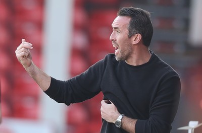 210326 - Walsall v Newport County - Sky Bet League 2 - Newport manager Christian Fuchs directs from the technical area