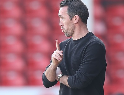 210326 - Walsall v Newport County - Sky Bet League 2 - Newport manager Christian Fuchs directs from the technical area