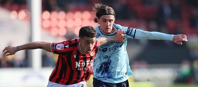 210326 - Walsall v Newport County - Sky Bet League 2 - Harrison Biggins of Newport and Alfie Young of Walsall FC